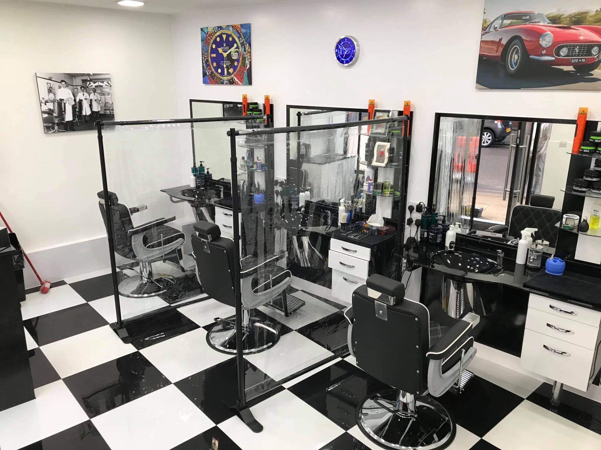 Inside Station Road Barbers — checkerboard floor, classic barber chairs and mirrors